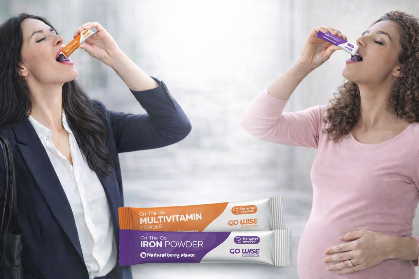 Two women taking Go Wise On The Go iron and multivitamin stick packs